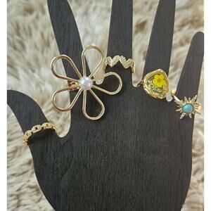 Set of 5 Gold Tone Decorative Women's Rings with Floral and Geometric Designs